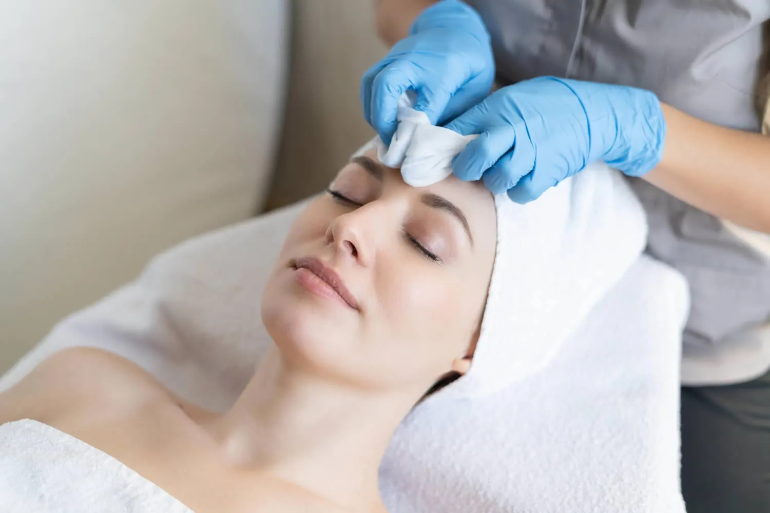 young-girl-receives-facial-cleansing-procedures-before-jetpeel