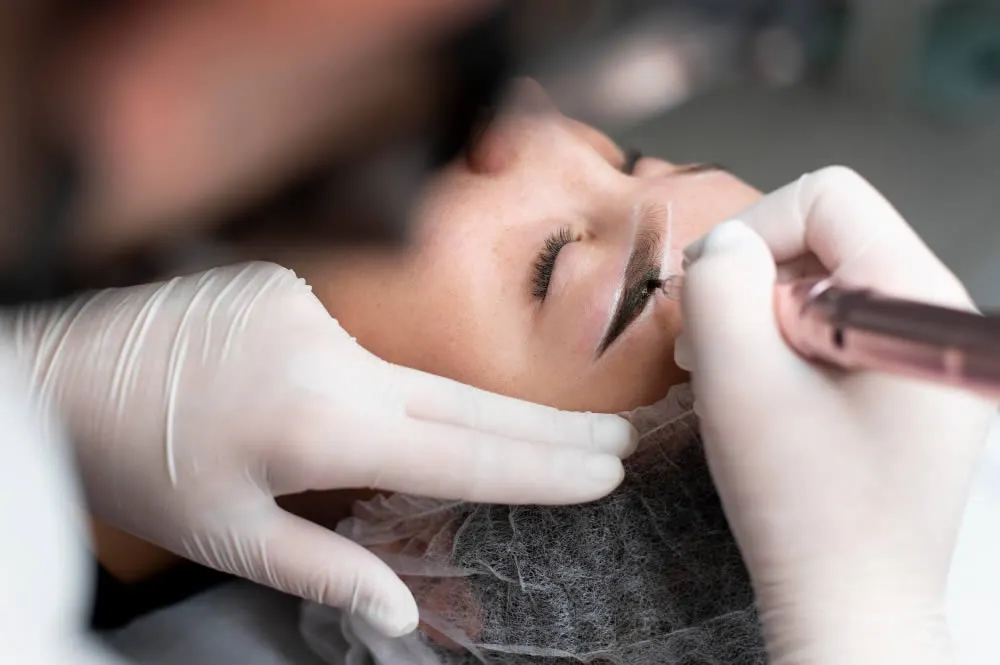 young-woman-going-through-permanent-makeup-eyebrow-treatment